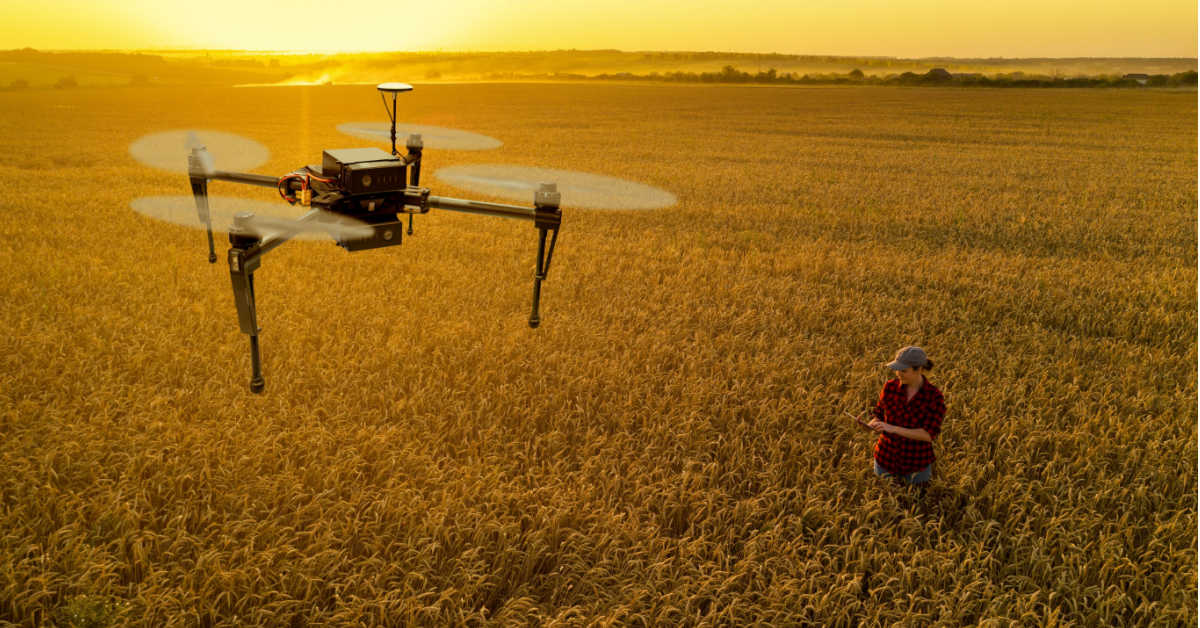 farmer controls ag tech drone with a tablet smart farming and precision agriculture